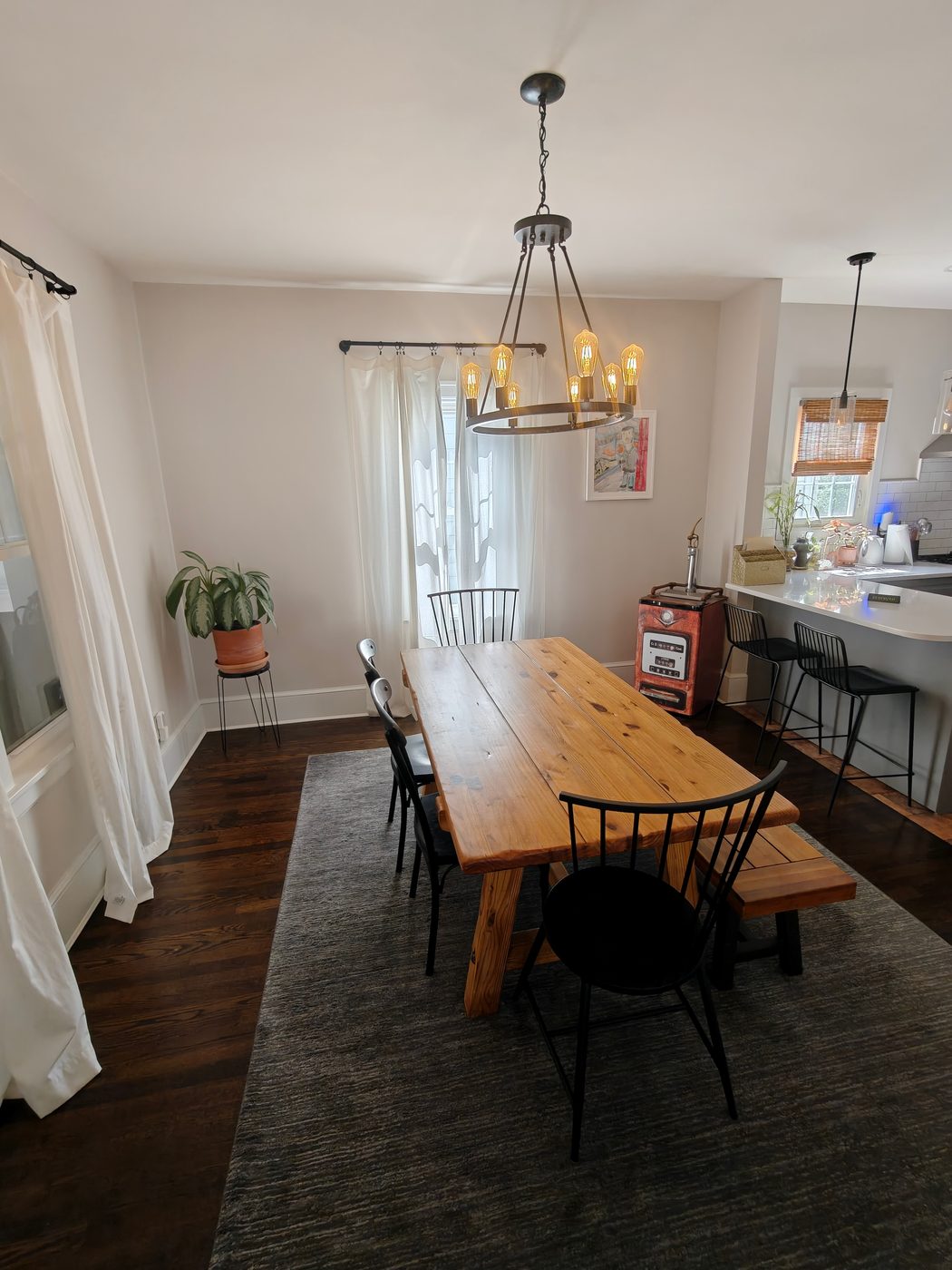 Chandelier hung and wired above a dining table