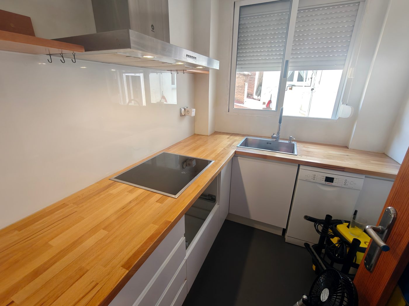 The finished kitchen with a solid beech worktop, induction hob and sink installed