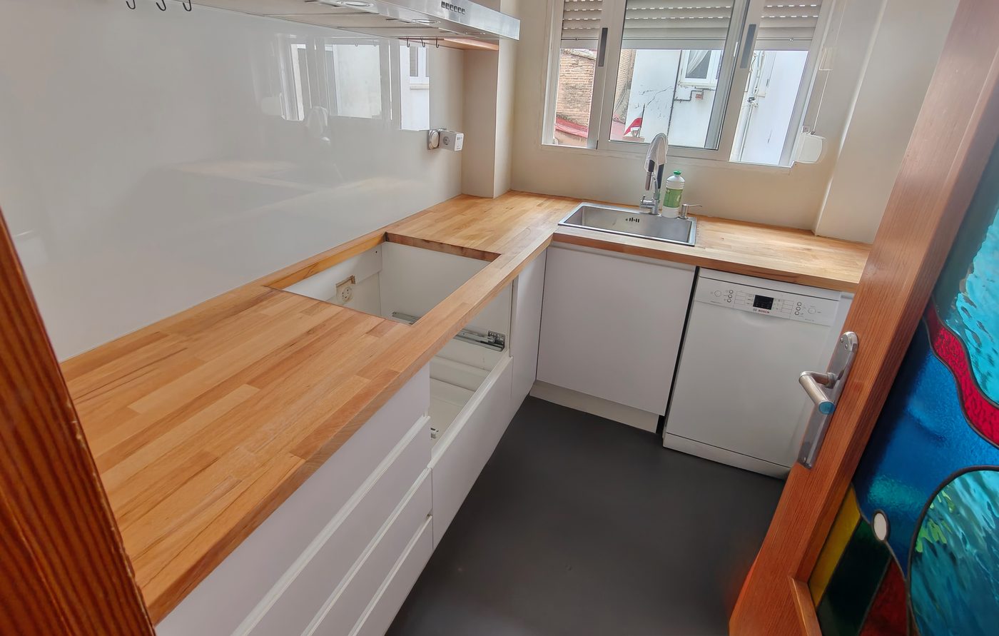 Kitchen mid-job, with the worktop cut and the hob opening still empty