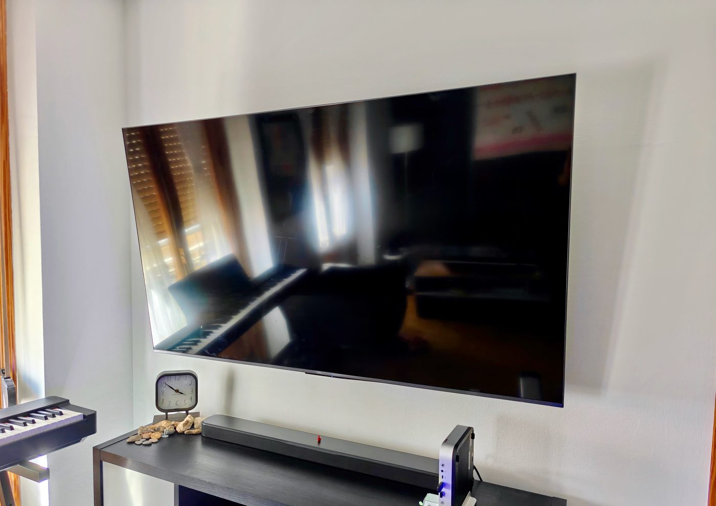 Large flat-screen TV mounted flush to the wall with all cables concealed